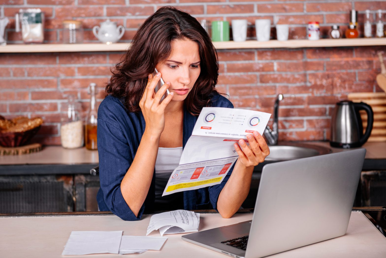 young women on the phone with surprise energy bill