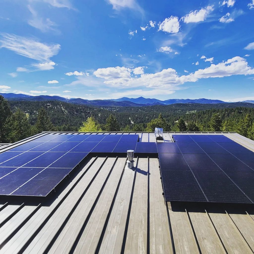 Rooftop solar system with Colorado mountains in background