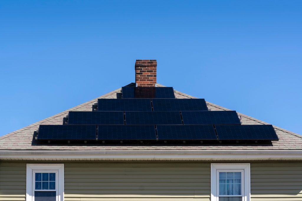 Solar panels installed on roof of suburban home