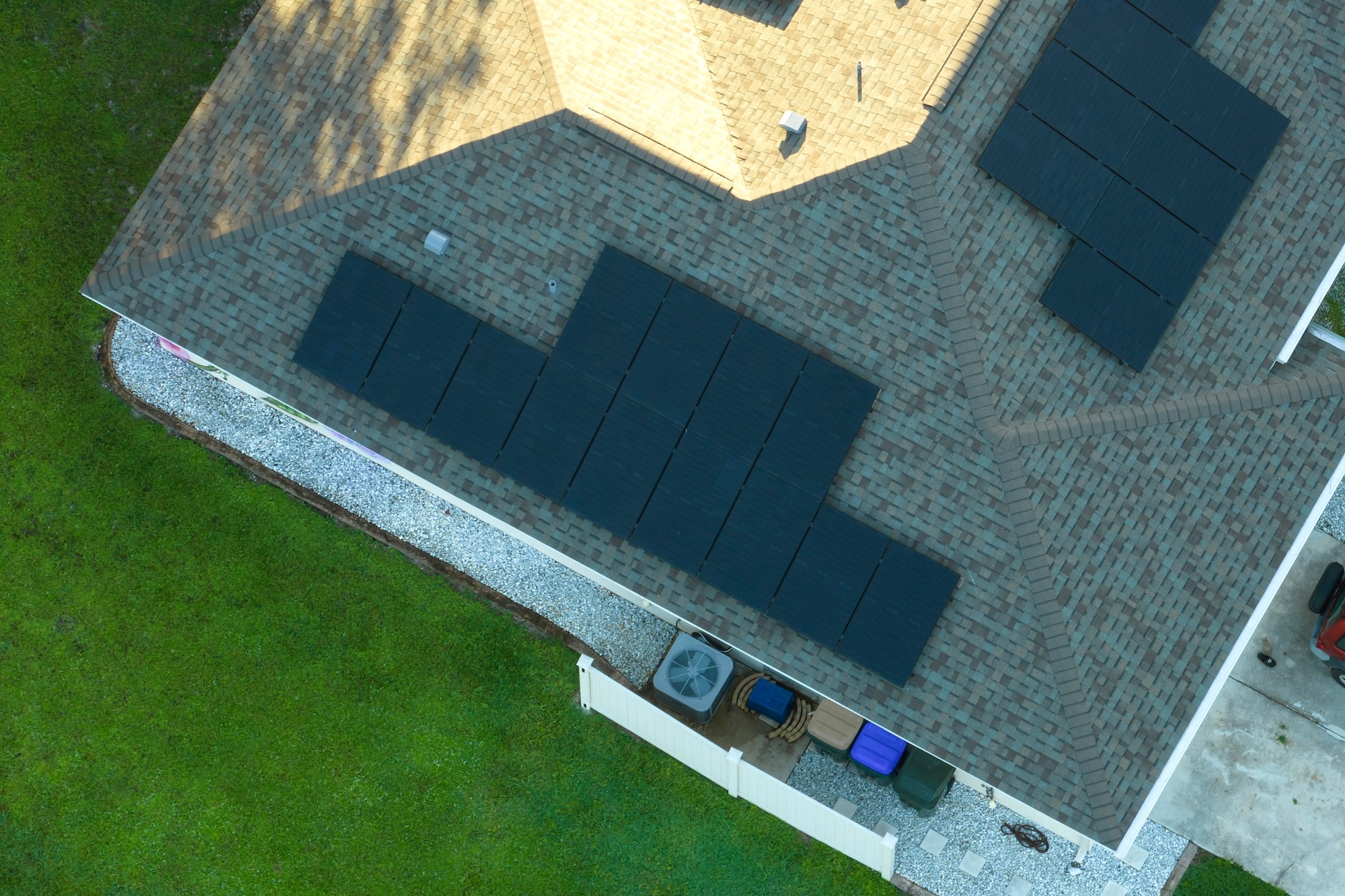Drone image of residential rooftop with solar panels